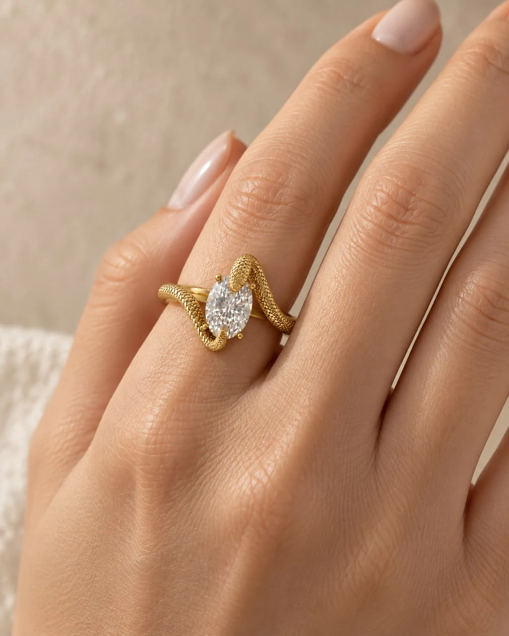 The Serpent No. 01 ring worn, the serpent turning across the finger